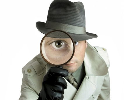 Detective-with-magnifying-glass-resized-600