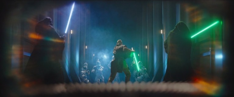 An image of a Jedi armed with a lightsaber and preparing to fight a lineup of Storm Troopers