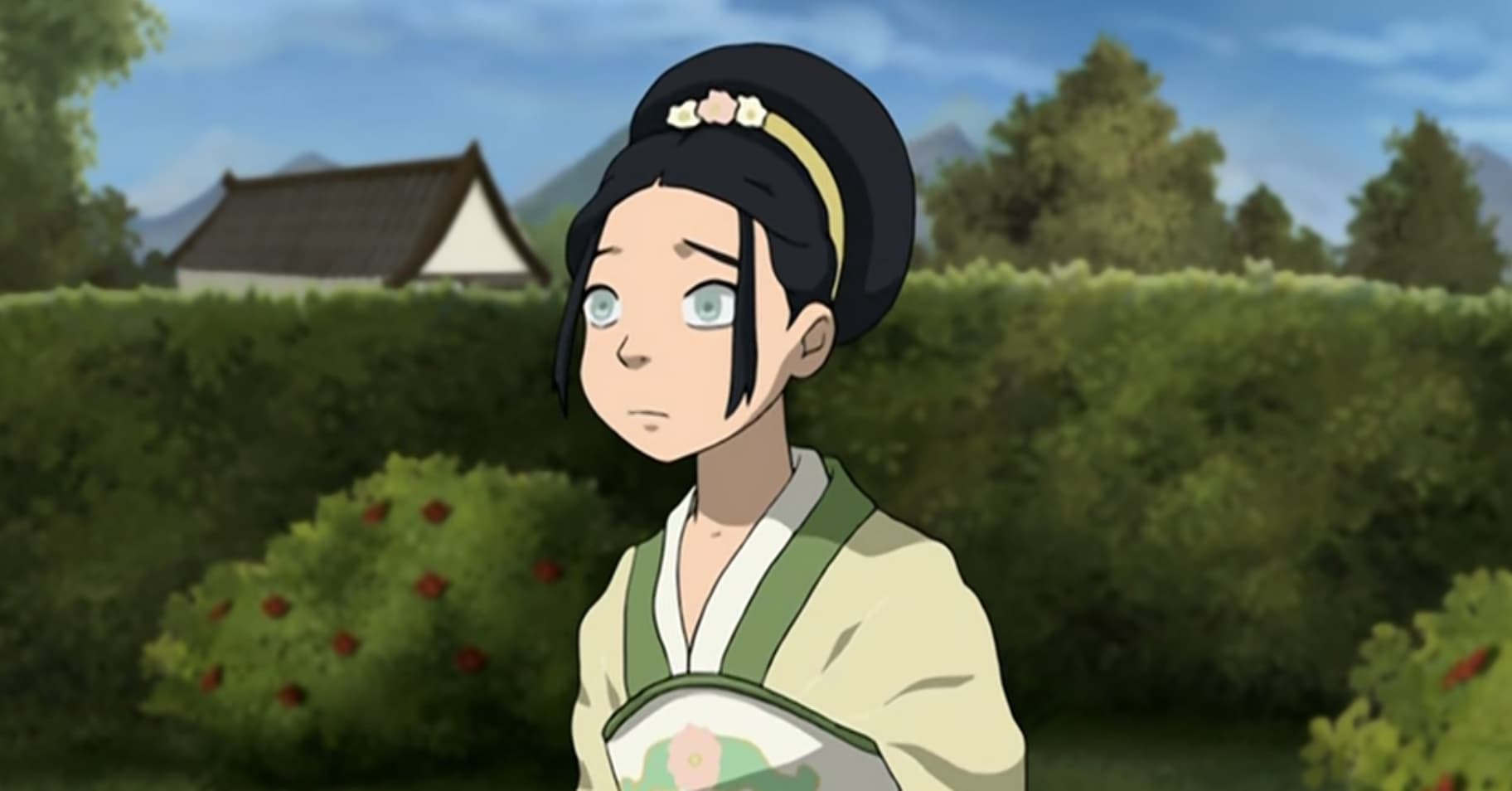 A young Toph Beifong dressed in formal garb